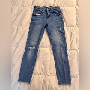 Zara Woman faded, torn stretch jeans with cut hems.